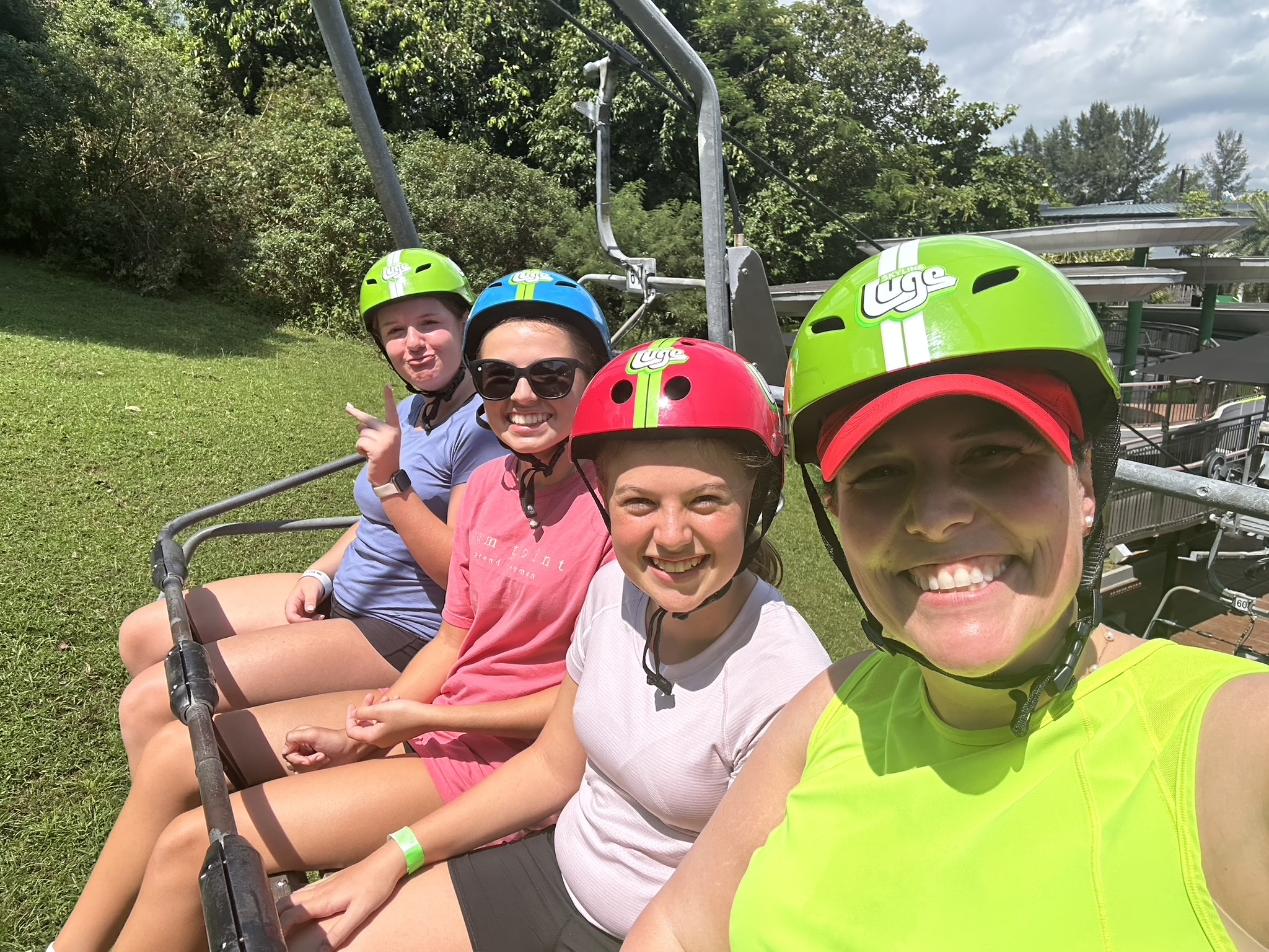 Family Adventure to Singapore, as we ride the ski lift to the top of the Luge track on Sentosa island.