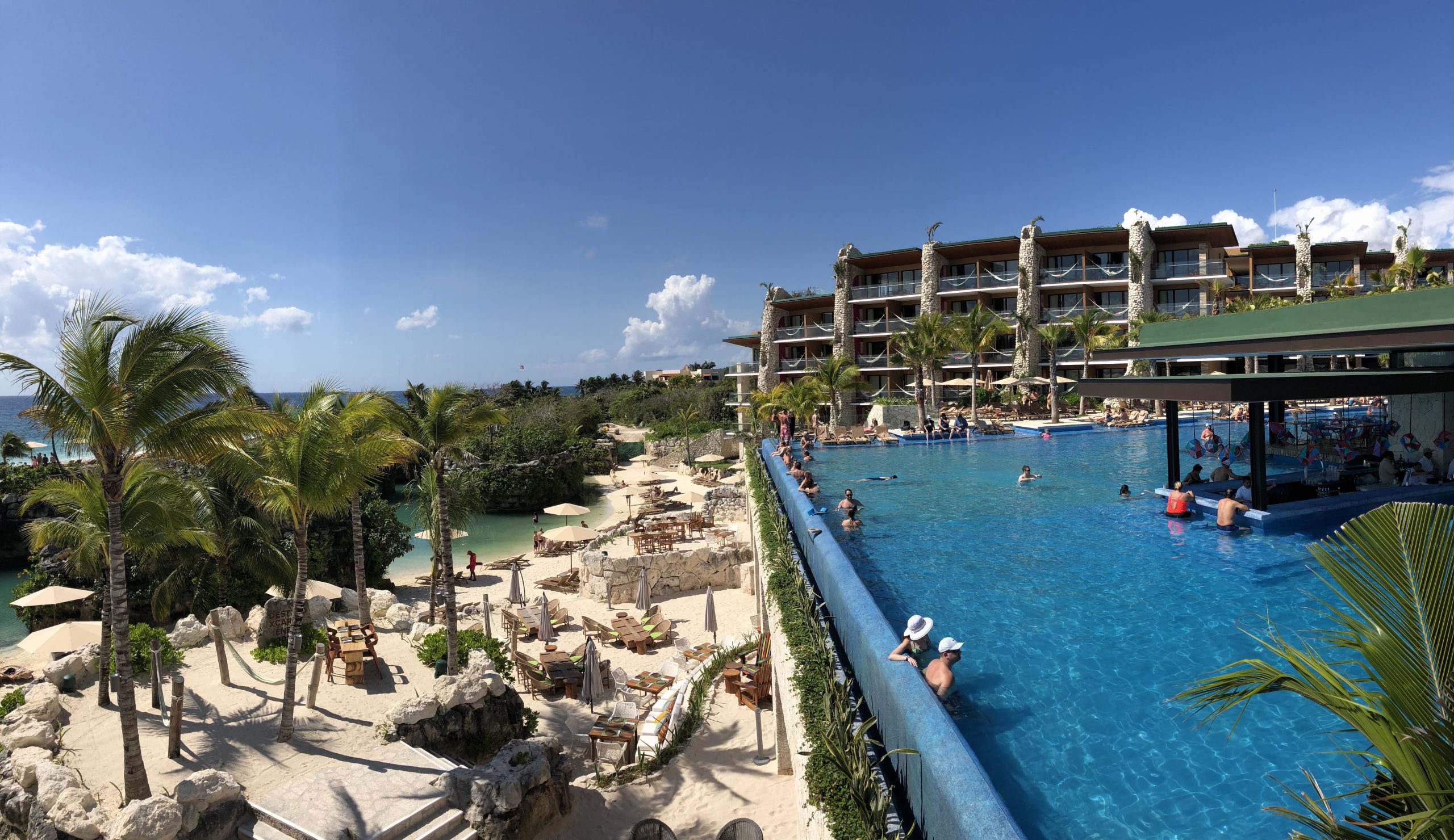 Natural lagoon pool with swim-up bar at Hotel Xcaret Mexico, a top family all-inclusive resort in the Mexican Caribbean