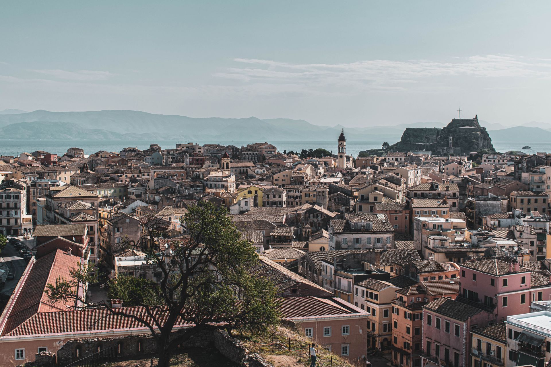 Scenic aerial view of Old Town Corfu with its distinctive fortress and Mediterranean architecture.